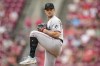 FILE - Miami Marlins relief pitcher David Robertson winds up during the team's baseball game against the Cincinnati Reds, Aug. 9, 2023, in Cincinnati. The World Series champion Texas Rangers are adding veteran reliever Robertson to their bullpen. A person familiar with the move confirmed it to The Associated Press, Thursday, Jan. 25, 2024, on condition of anonymity because the deal was pending a physical. (AP Photo/Jeff Dean, File)