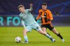 FILE - Royal Antwerp's Arthur Vermeeren, left, runs with the ball next to Shakhtar's Heorhiy Sudakov during the Champions League group H soccer match between Shakhtar Donetsk and Antwerp at Volksparkstadion in Hamburg, Germany, Tuesday, Nov. 28, 2023. Atletico Madrid says it has signed young Belgium midfielder Arthur Vermeeren from Antwerp. Vermeeren impressed by scoring a goal in Antwerp’s 3-2 upset of Barcelona 3-2 in the Champions League group phase this season. (AP Photo/Martin Meissner, File)