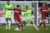 Cologne's Denis Huseinbasic, left, and Wolfsburg's Aster Vranckx battle for the ball during the Bundesliga soccer match between VfL Wolfsburg and 1. FC Koln at Volkswagen Arena, Wolfsburg, Germany, Saturday Jan. 27, 2024. (Swen Pfortner/dpa via AP)