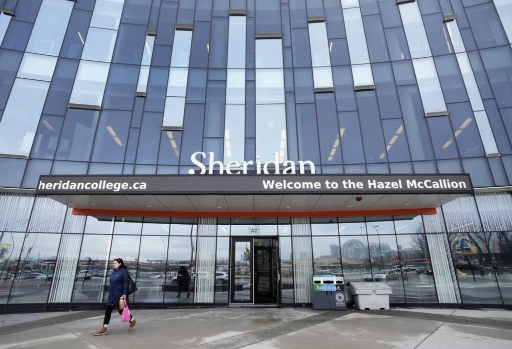 A person leaves Sheridan College's Hazel McCallion Campus in Mississauga, Ont., on Friday, January 26, 2024. THE CANADIAN PRESS/Nathan Denette