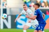 Heidenheim's Lennard Maloney, left, and Hoffenheim's Grischa Promel battle for the ball during the Bundesliga soccer match between TSG 1899 Hoffenheim and 1. FC Heidenheim at PreZero Arena, Sinsheim, Germany, Saturday Jan. 27, 2024. (Uwe Anspach/dpa via AP)