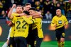 Dortmund's Niclas F'ulkrug, center, celebrates his goal with teammates Ian Maatsen and Jadon Sancho., during the German Bundesliga soccer match between Bernd Thissen and VfL Bochum, in Dortmund, Germany, Sunday, Jan.28, 2024. (Bernd Thissen/dpa via AP)