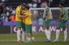 Australia's Harry Souttar, left, and teammates celebrate after their win in the Asian Cup round of 16 soccer match between Australia and Indonesia at Jassim Bin Hamad Stadium in Doha, Qatar, Sunday, Jan. 28, 2024. (AP Photo/Aijaz Rahi)