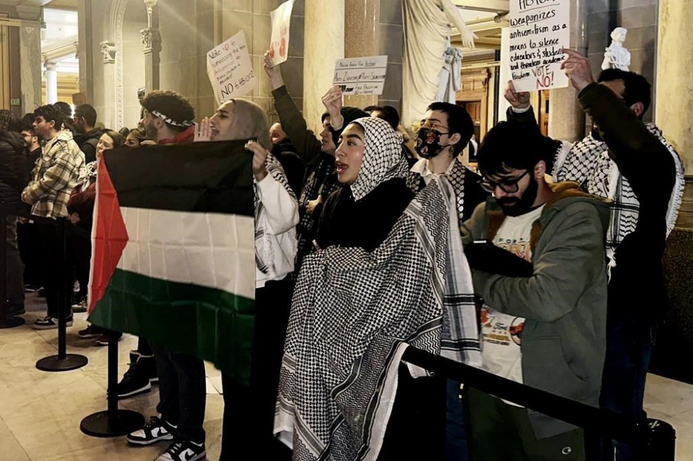 FILE - Protestors rally outside of the Indiana House chamber against House Bill 1002, which defines antisemitism and bans its teaching at Indiana schools, Jan 18, 2024, in Indianapolis. A handful of U.S. states are considering measures that would define antisemitism, but there's debate over whether they would stifle criticism of Israel. (AP Photo/Isabella Volmert, file)