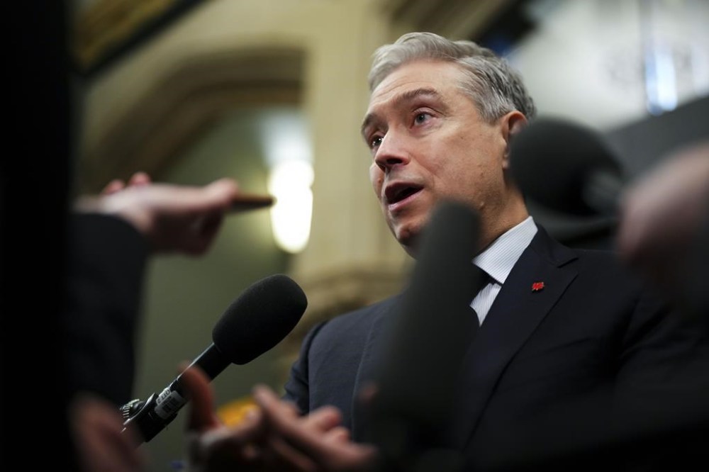 Innovation, Science and Industry Minister Francois-Philippe Champagne arrives to a cabinet meeting on Parliament Hill in Ottawa on Tuesday, Jan. 30, 2024. Champagne says he spoke to a foreign grocer just this morning as part of his efforts to court new players to enter Canada's grocery sector. THE CANADIAN PRESS/Sean Kilpatrick
