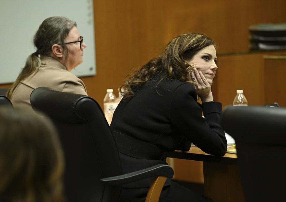 Defense Attorney Shannon Smith listens to the prosecutor's question Jennifer Crumbley's former boss Andrew Smith, of Princeton Management, as he testifies during Crumbley's trial at Oakland County Courthouse, Tuesday, Jan. 30, 2024, in Pontiac, Mich. Crumbley, 45, is charged with involuntary manslaughter. Prosecutors say she and her husband were grossly negligent and could have prevented the four deaths if they had tended to their son’s mental health. They’re also accused of making a gun accessible at home. (Clarence Tabb Jr./Detroit News via AP)