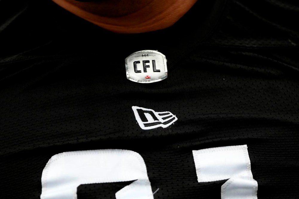 The CFL free agency process will kick into high gear Sunday. That's when the league's free-agency window will open and CFL teams will be able to talk freely with any pending free agents or their representatives. The CFL logo is seen on a jersey in Ottawa on Thursday, May 19, 2022. THE CANADIAN PRESS/Justin Tang