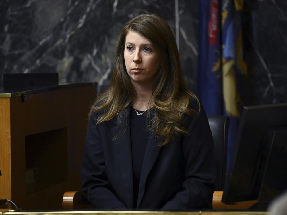Witness Amanda Holland, a former co-worker of Jennifer Crumbley at Princeton Management, testifies during Crumbley's trial at Oakland County Courthouse, Tuesday, Jan. 30, 2024, in Pontiac, Mich. Crumbley, 45, is charged with involuntary manslaughter. Prosecutors say she and her husband were grossly negligent and could have prevented the four deaths if they had tended to their son’s mental health. They’re also accused of making a gun accessible at home. (Clarence Tabb Jr./Detroit News via AP)