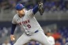 FILE - New York Mets relief pitcher Adam Ottavino throws during the ninth inning of a baseball game against the Miami Marlins, Sept. 18, 2023, in Miami. Ottavino and the Mets finalized a one-year contract Tuesday, Jan. 30, 2024, that keeps the veteran reliever with his hometown team. (AP Photo/Lynne Sladky, File)