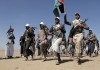 File - Houthi fighters march during a rally of support for the Palestinians in the Gaza Strip and against the U.S. strikes on Yemen outside Sanaa on Jan. 22, 2024. Attacks on ships in the Red Sea by Houthi rebels have unraveled a key global trade route, forcing vessels into longer and more costly journeys around Africa. (AP Photo)