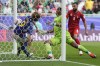 Japan's Ayase Ueda, left, scores an own goal during the Asian Cup Round of 16 soccer match between Bahrain and Japan, at Al Thumama Stadium in Doha, Qatar, Wednesday, Jan. 31, 2024. (AP Photo/Thanassis Stavrakis)