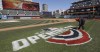 FILE - Mathew Gudin paints the opening day signage on the field before Cleveland plays the Chicago White Sox in a baseball game, Monday, April 1, 2019, in Cleveland. Officials are estimating 200,000 visitors will descend upon Cleveland April 8, 2024, to view a total solar eclipse — a once-in-generations event. The Cleveland Guardians baseball team has their home opener the same day. The Guardians have started their home openers in recent years with a 4:10 p.m. first pitch. This year, though, that falls in the partial-eclipse window. The team is weighing whether to embrace the eclipse and open the ballpark earlier to allow fans to watch the eclipse together — an opening act on opening day. ((AP Photo/Tony Dejak, File)