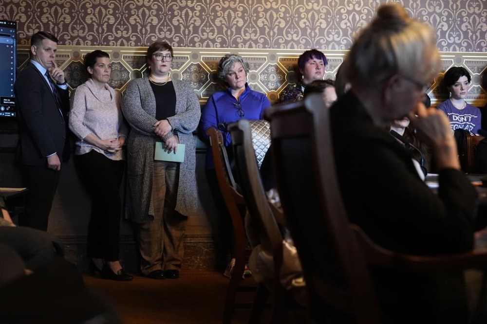 People look on during an Iowa House Judiciary subcommittee hearing, Wednesday, Jan. 31, 2024, at the Statehouse in Des Moines, Iowa. Iowa lawmakers declined to advance a bill that would strip