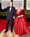 FILE - Brian Wilson, left, and Melinda Ledbetter arrive at the 73rd annual Golden Globe Awards in Beverly Hills, Calif., on Jan. 10, 2016. Ledbetter Wilson, the longtime wife and manager of Brian Wilson whom the Beach Boys co-founder often credited for stabilizing his famously troubled life, has died at age 77. (Photo by Jordan Strauss/Invision/AP, File)