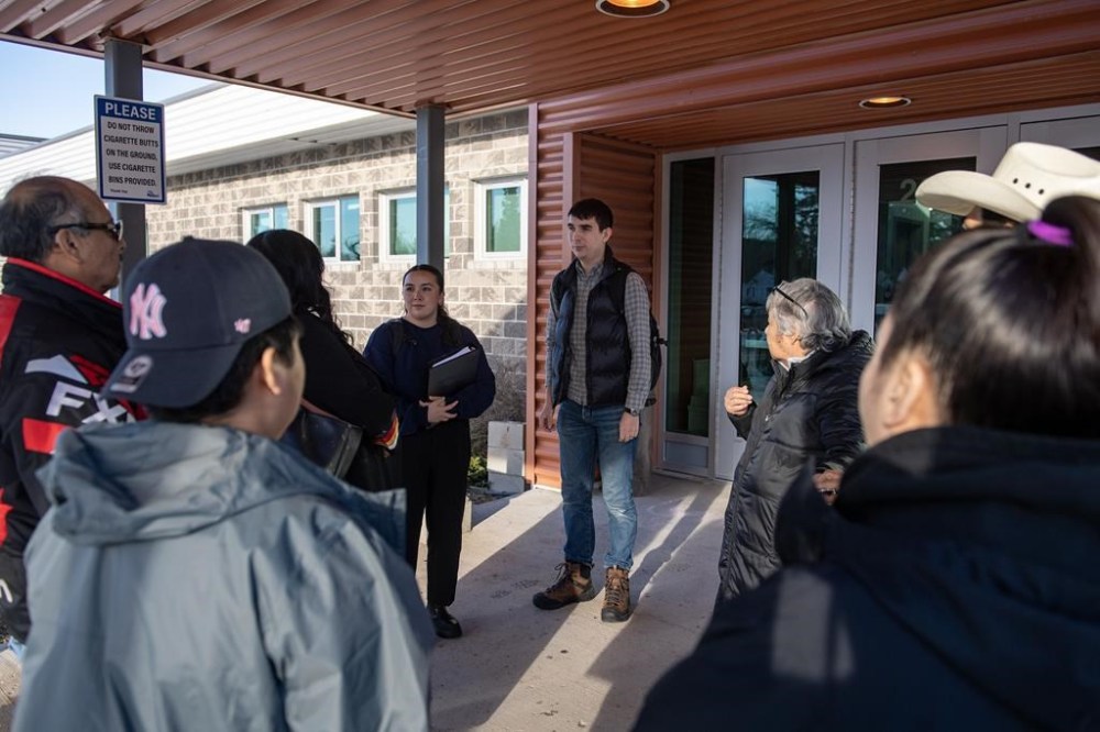 Keith Brown, the lawyer representing the James Smith Cree Nation, speaks with people as they enter the public coroner's inquest into the mass stabbings that happened on James Smith Cree Nation in 2022 in Melfort, Sask., Wednesday, Jan. 31, 2024. THE CANADIAN PRESS/Liam Richards