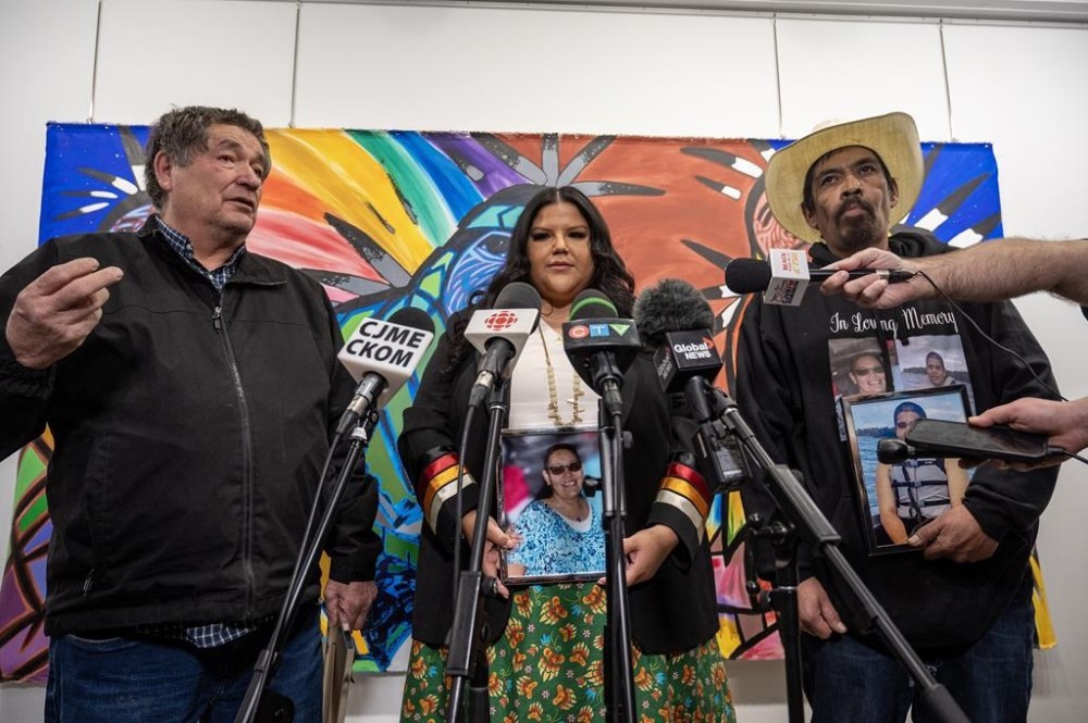 Darryl Burns, left to right, whose sister Gloria was one of the people killed on James Smith Cree Nation, Chelsey Stonestand, a representative of Burns' family, and Brian (Buggy) Burns, whose wife, Bonnie, and son, Gregory, were both killed, speaks to media following the final day of the public coroner's inquest into the mass stabbings that happened on James Smith Cree Nation in 2022 in Melfort, Sask. on Wednesday, January 31, 2024. THE CANADIAN PRESS/Liam Richards
