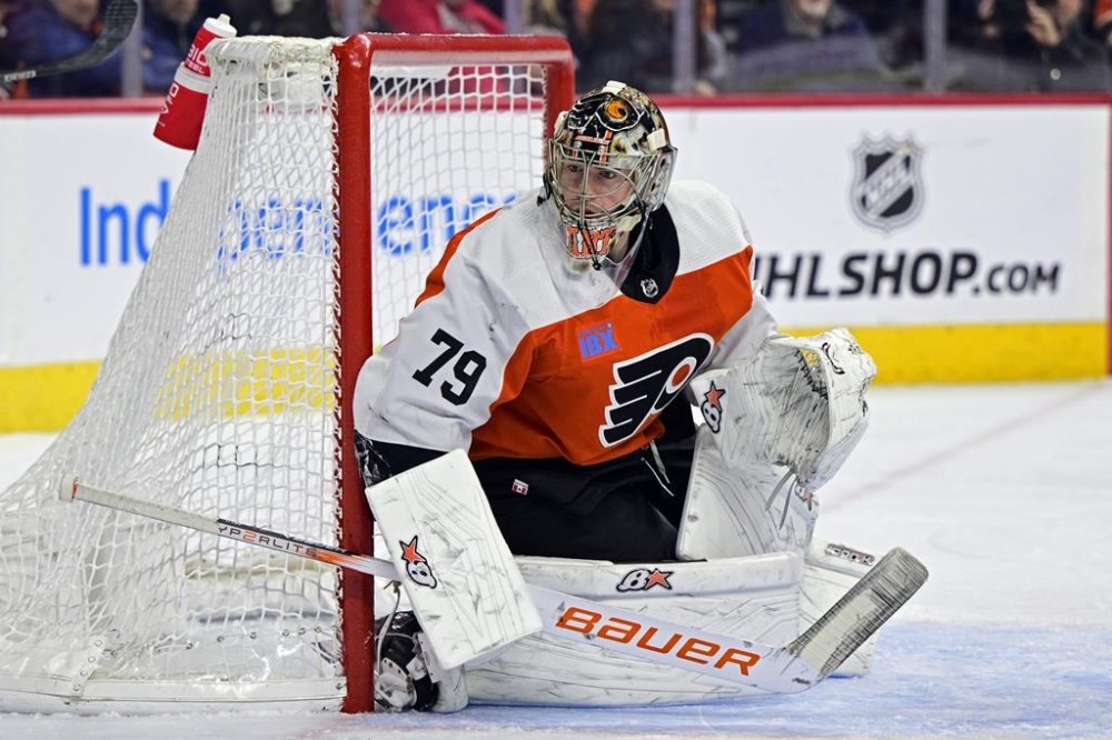 Philadelphia Flyers' goaltender Carter Hart guards the net during an NHL hockey game against the Colorado Avalanche, Saturday, Jan. 20, 2024, in Philadelphia. Calgary Flames forward Dillon Dube, Philadelphia Flyers goaltender Carter Hart, the New Jersey Devils' Michael McLeod and Cal Foote, and former Ottawa Senator Alex Formenton, all members of the 2018 Canadian world junior team, are facing sexual assault charges. THE CANADIAN PRESS/AP, Derik Hamilton