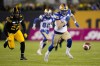 Winnipeg Blue Bombers defensive back Nick Hallett (21) and Hamilton Tiger-Cats running back Jackson Bennett (29) chase a loose ball during first half football action in the 108th CFL Grey Cup in Hamilton, Ont., on Sunday, December 12, 2021. Canadian defensive backs Nick and Noah Hallett agreed to terms on contract extensions with the Winnipeg Blue Bombers on Thursday.THE CANADIAN PRESS/Nathan Denette