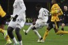 Manchester United's Kobbie Mainoo, centre, scores his side's fourth goal during the English Premier League soccer match between Wolverhampton Wanderers and Manchester United at the Molineux Stadium in Wolverhampton, England, Thursday, Feb. 1, 2024. (AP Photo/Rui Vieira)