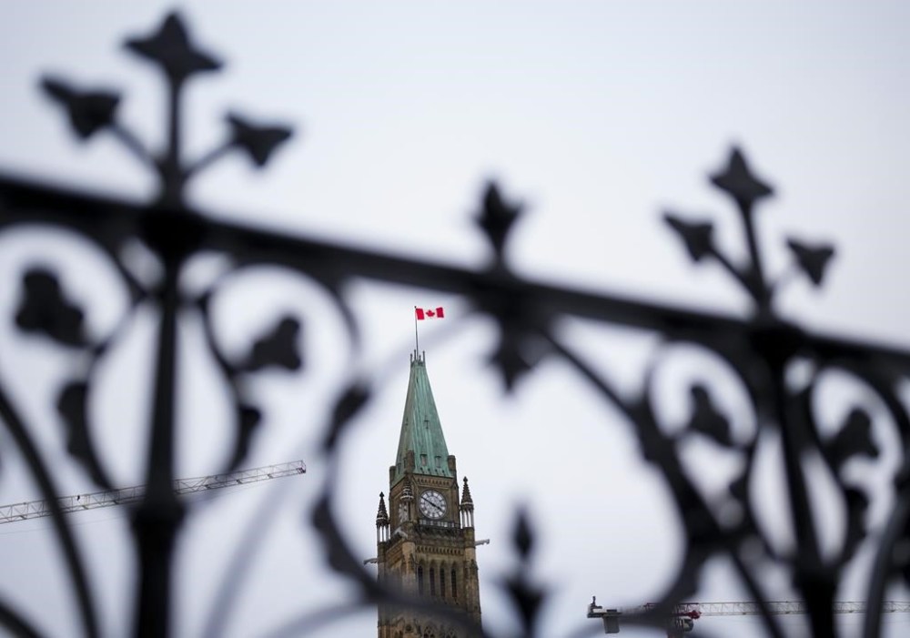 The Peace Tower is pictured on Parliament Hill in Ottawa on Tuesday, Dec. 19, 2023. The federal government is releasing previously classified details from a report that outlines the extent to which Canada provided a safe haven to former Nazis during the Cold War. THE CANADIAN PRESS/Sean Kilpatrick