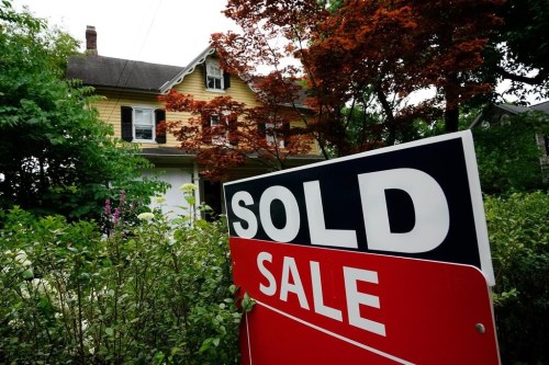 FILE - A sale sign stands outside a home in Wyndmoor, Pa., June 22, 2022. One of the nation's largest real estate brokerages has agreed Thursday, Feb. 1, 2024, to pay $70 million as part of a proposed settlement to resolve more than a dozen lawsuits across the country over agent commissions. (AP Photo/Matt Rourke, File)