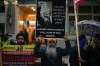 A man holds a sign with a photograph of Hardeep Singh Nijjar during a protest outside the Indian Consulate in Vancouver on Monday, Sept. 25, 2023. The spokesman for a group advocating Sikh independence says that a Metro Vancouver home hit by gunfire on Thursday belonged to a member of the movement. THE CANADIAN PRESS/Darryl Dyck