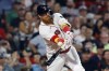Boston Red Sox's Justin Turner hits an RBI double during the sixth inning of a baseball game against the Baltimore Orioles, Friday, Sept. 8, 2023, in Boston. Turner says it's hard to wrap your head around playing for an entire country, but he's looking forward to getting a chance with the Toronto Blue Jays. THE CANADIAN PRESS/AP/Michael Dwyer