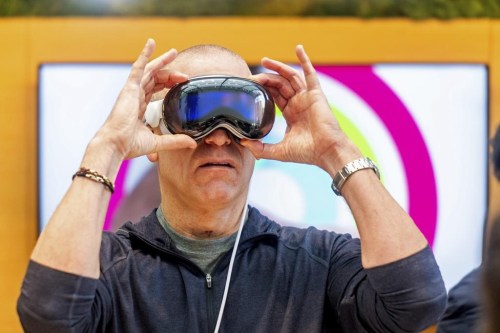 Scott Joachim tries out an Apple Vision Pro headset during the first day of sales at a Palo Alto, Calif., Apple store on Friday, Feb. 2, 2024. (AP Photo/Noah Berger)