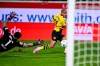 Heidenheim goalkeeper Kevin Mueller, left, in action against Dortmund's Donyell Malen offside goal during the German Bundesliga soccer match between Borussia Dortmund and 1. FC Heidenheim at the Voith-Arena in Heidenheim, Germany, Friday Feb. 2, 2024. (Harry Langer/dpa via AP)