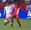 The New York Red Bulls have named former Canada captain Julian de Guzman as their new sporting director. Mexico's Rafael Marquez, left, passes the ball past de Guzman during first half FIFA World Cup qualifying soccer action in Vancouver, B.C., Friday March 25, 2016. THE CANADIAN PRESS/Darryl Dyck