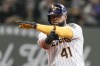 FILE - Milwaukee Brewers' Carlos Santana reacts after hitting an RBI double during the fifth inning of a baseball game against the San Diego Padres Saturday, Aug. 26, 2023, in Milwaukee. The Minnesota Twins added a veteran bat on Friday, Feb. 2, 2024, agreeing to a one-year contract with Carlos Santana that is worth $5.25 million.(AP Photo/Morry Gash, File)