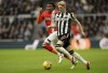 Luton Town's Gabriel Osho, left, and Newcastle United's Anthony Gordon battle for the ball during the English Premier League soccer match between Newcastle and Luton Town at St. James' Park, Newcastle upon Tyne, England, Saturday, Feb. 3, 2024. (Owen Humphreys/PA via AP)