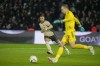 PSG's Kylian Mbappe, back, challenges Brest's goalkeeper Marco Bizot during the French League One soccer match between Paris Saint-Germain and Brest at the Parc des Princes stadium in Paris, France, Sunday, Jan. 28, 2024. (AP Photo/Thibault Camus)