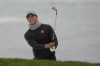 Adam Scott hits toward the 18th green at Pebble Beach Golf Links during the third round of the AT&T Pebble Beach National Pro-Am golf tournament in Pebble Beach, Calif., Saturday, Feb. 3, 2024. (AP Photo/Ryan Sun)
