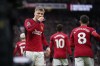 Manchester United's Rasmus Hojlund celebrates after scoring his side's first goal during the English Premier League soccer match between Manchester United and West Ham United at the Old Trafford stadium in Manchester, England, Sunday, Feb. 4, 2024. (AP Photo/Dave Thompson)