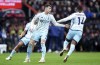 Nottingham Forest's Callum Hudson-Odoi, right, celebrates scoring their side's first goal of the game with team-mates during the Premier League match between AFC Bournemouth and Nottingham Forest at the Vitality Stadium, in Bournemouth, England, Sunday Feb. 4, 2024. (Zac Goodwin/PA via AP)