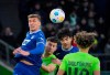 Hoffenheim's Grischa Promel, left, and Ozan Kabak are challenged by Wolfsburg's Jonas Wind and Kevin Paredes, right, during the Bundesliga soccer match between VfL Wolfsburg and TSG 1899 Hoffenheim at Volkswagen Arena, Wolfsburg, Germany, Sunday Feb. 4, 2024. (Soeren Stache/dpa via AP)