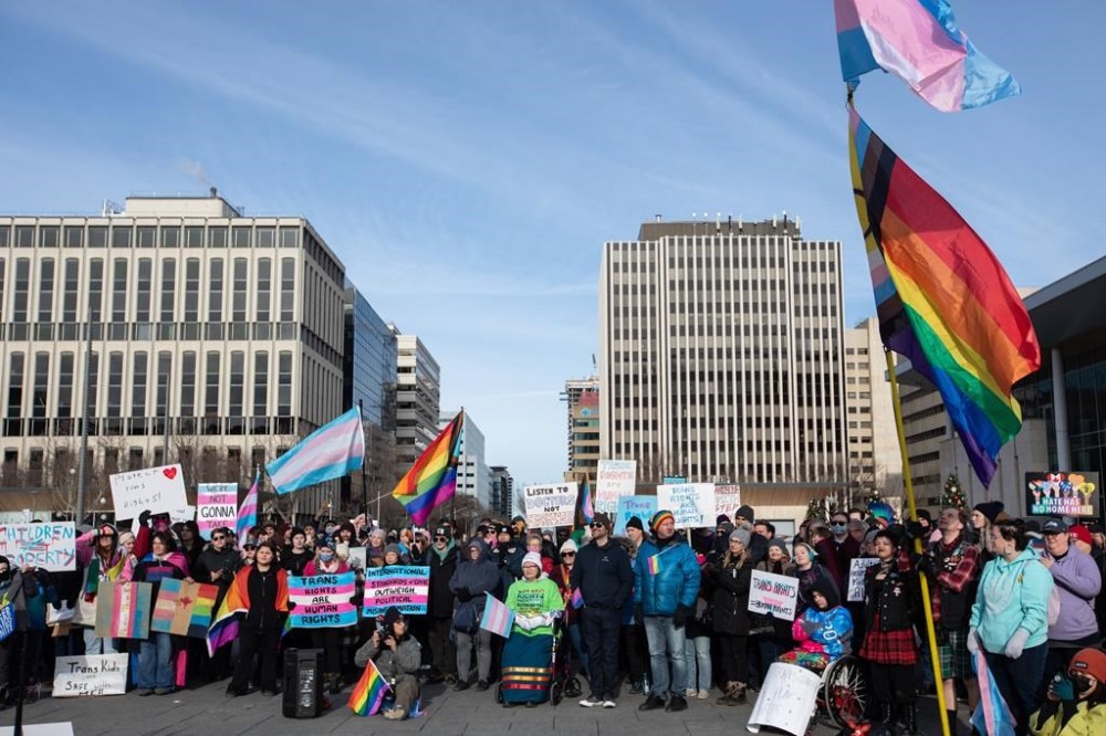 Groups opposed to the Alberta government's planned policies around transgender youth held rallies in Calgary and Edmonton over the weekend, with many of the attendees warning the plans will out trans kids and put their lives in jeopardy. Protestors gather at the legislature during a rally for trans rights in Edmonton, Sunday, Feb. 4, 2024. THE CANADIAN PRESS/Amber Bracken