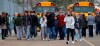 Parents walk away with their kids from the Meijer's parking lot, where many students gathered following an active shooter situation at Oxford High School, Nov. 30, 2021, in Oxford, Mich. The mother of a Michigan school shooter is headed to trial on involuntary manslaughter charges. Prosecutors are trying to pin criminal responsibility on Ethan Crumbley's parents in the deaths of four students at Oxford High School in 2021. Jennifer and James Crumbley are not accused of knowing their son planned to kill fellow students. But prosecutors say they were grossly negligent by making a gun accessible to Ethan Crumbley and ignoring his mental health needs. (Eric Seals/Detroit Free Press via AP, file)