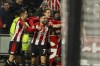 Brentford's Neal Maupay, center, celebrates with tyeammates after scoring his side's opening goal during the English Premier League soccer match between Brentford and Manchester City at the Gtech Community Stadium in London, Monday, Feb. 5, 2024. (AP Photo/Ian Walton)
