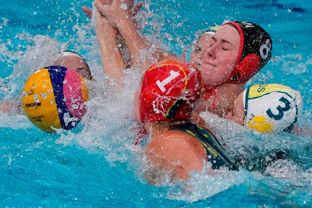 Australia's goalkeeper Lea Yanitsas (1) and Hannah Buckling (3) battle with Canada's Elyse Lemay-Lavoie (8) during a classification round women's water polo match at the 2020 Summer Olympics, Thursday, Aug. 5, 2021, in Tokyo, Japan. The Canadian women’s water polo team improved to 2-and-0 at the world aquatics championships with a 20-5 win over Great Britain on Tuesday. THE CANADIAN PRESS/AP/Mark Humphrey