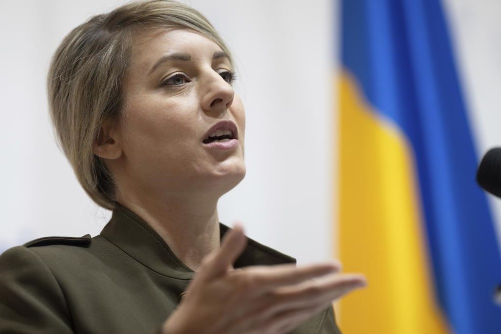 Canada's Foreign Minister Melanie Joly speaks to the media during a press conference with Ukraine's Foreign Minister Dmytro Kuleba in Kyiv, Ukraine, on Friday, Feb. 2, 2024. The Liberal government says a vote to modernize Canada's free trade agreement with Ukraine will tests MPs commitment to helping the war-torn country following Russia's invasion nearly two years ago. THE CANADIAN PRESS/AP/Evgeniy Maloletka
