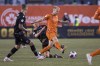 Forge FC midfielder Kyle Bekker (10) is tripped up by Cavalry FC midfielder Jesse Daley (8) during first half Canadian Premier League finals soccer action in Hamilton on Saturday, Oct. 28, 2023. CPL champion Forge FC, whose league season doesn't start until April 13, jumps into the deep end of CONCACAF Champions Cup play Wednesday when it hosts Chivas Guadalajara in the first leg of their first-round series. THE CANADIAN PRESS/Nick Iwanyshyn