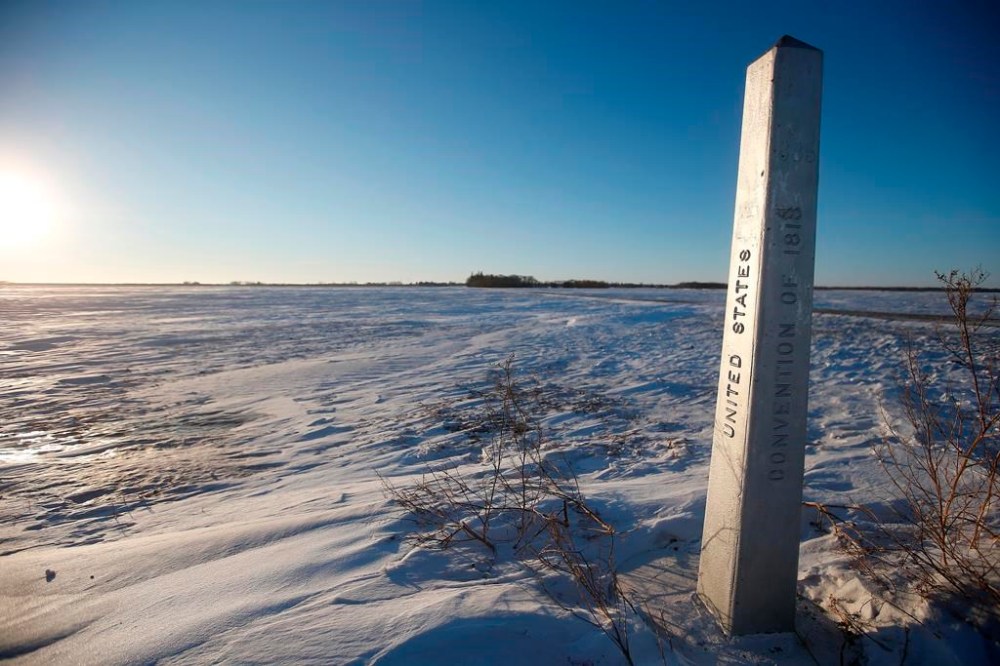 A border marker is shown just outside of Emerson, Man. on Thursday, Jan. 20, 2022. A Calgary man has been arrested for human smuggling after police allege he picked up a group of foreign nationals who had crossed into Manitoba from the United States by foot. THE CANADIAN PRESS/John Woods