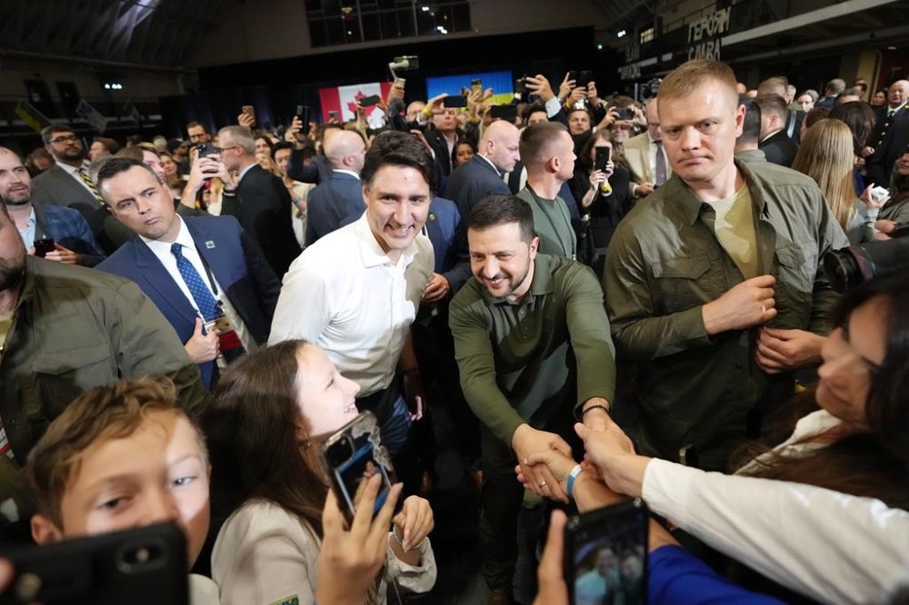 Prime Minister Justin Trudeau says by criticizing his office for inviting a man who fought for the Nazis to a reception for the Ukrainian president, the Conservatives are actually attacking the Ukrainian Canadian Congress. Trudeau and Ukrainian President Volodymyr Zelenskyy greet supporters after a rally at the Fort York Armoury in Toronto on Friday, September 22, 2023. THE CANADIAN PRESS/Nathan Denette