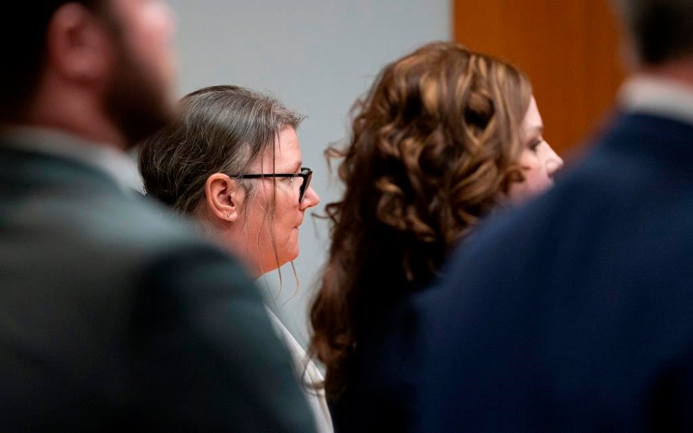 Jennifer Crumbley stands as the jury is seated in the Oakland County courtroom before guilty verdicts were read on four counts of involuntary manslaughter in the Oakland County courtroom of Cheryl Matthews on Tuesday, Feb. 6, 2024 in Pontiac, Mich. Prosecutors say Crumbley was grossly negligent when she failed to tell Oxford High School that the family had guns, including a 9 mm handgun that her son, Ethan Crumbley, used at a shooting range on the weekend before the Nov. 30, 2021, attack. (Mandi Wright/Detroit Free Press via AP, Pool)