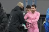 Inter Miami's Lionel Messi, right gives his jersey to a Vissel Kobe's official after their friendly soccer match at the National Stadium, Wednesday, Feb. 7, 2024, in Tokyo, Japan. (AP Photo/Eugene Hoshiko)