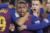 FILE - Barcelona players hug teammate Malcolm, center, after he scored his side's first goal during the Copa del Rey semifinal first leg soccer match between FC Barcelona and Real Madrid at the Camp Nou stadium in Barcelona, Spain, on Feb. 6, 2019. Barcelona’s pursuit of a $525,000 bonus from Zenit St. Petersburg, for the Russian soccer club qualifying for the Champions League it was later excluded from during the invasion of Ukraine, is going to the Court of Arbitration for Sport. (AP Photo/Emilio Morenatti)