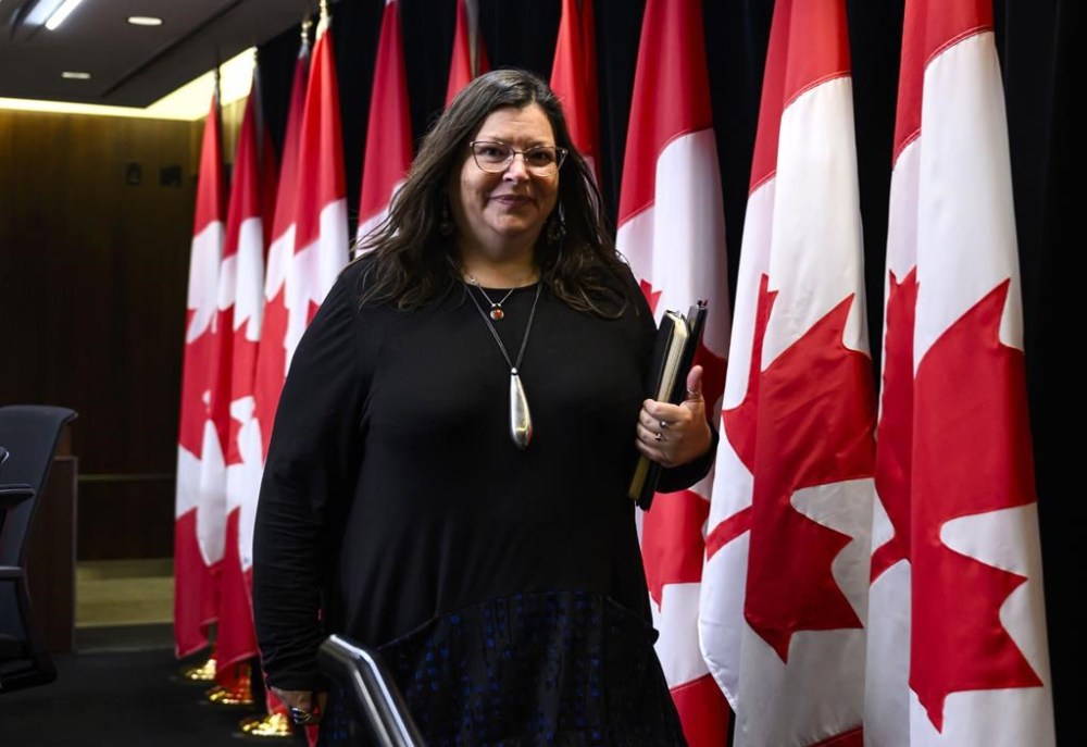 Federal Housing Advocate Marie-Josée Houle leaves a news conference in Ottawa on Monday, Nov. 27, 2023. As provinces look to hotels to provide temporary housing to people living in homeless encampments, Houle says governments must take their cues from the unhoused people they're trying to serve and look for permanent solutions. THE CANADIAN PRESS/Justin Tang