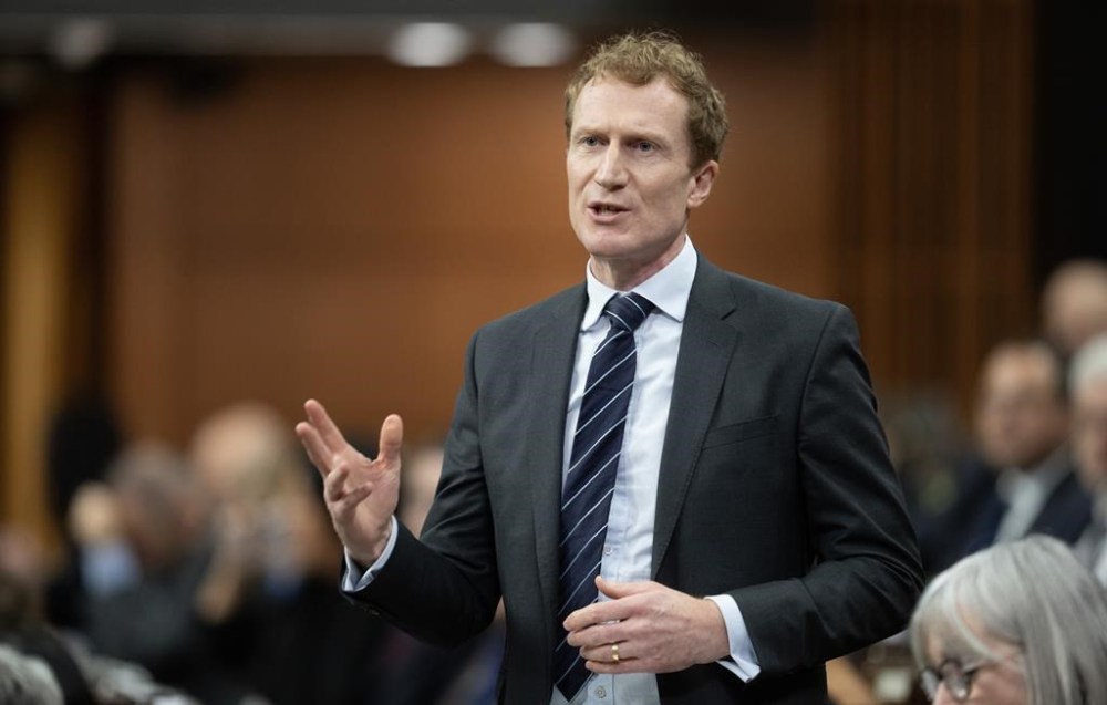 Immigration Minister Marc Miller rises during Question Period, in Ottawa, Tuesday, Jan. 30, 2024. Miller says he's frustrated and 'pissed off' that a list of people related to Canadians are being blocked from leaving the embattled Gaza Strip to be screened to come to Canada.THE CANADIAN PRESS/Adrian Wyld